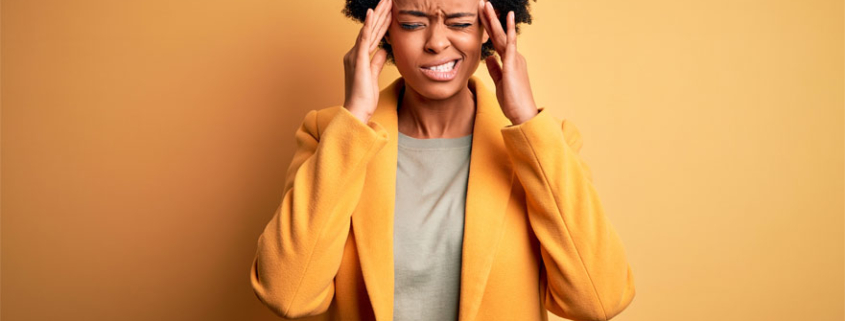 Woman suffering from Migraine