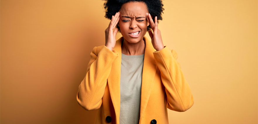 Woman suffering from Migraine